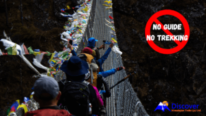 No Solo Trekking in Nepal. Pic: Guides leading the trekkers to the another end of the bridge safely